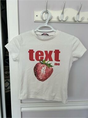 Edikted White Tee with Red "text me" and Strawberry Graphic